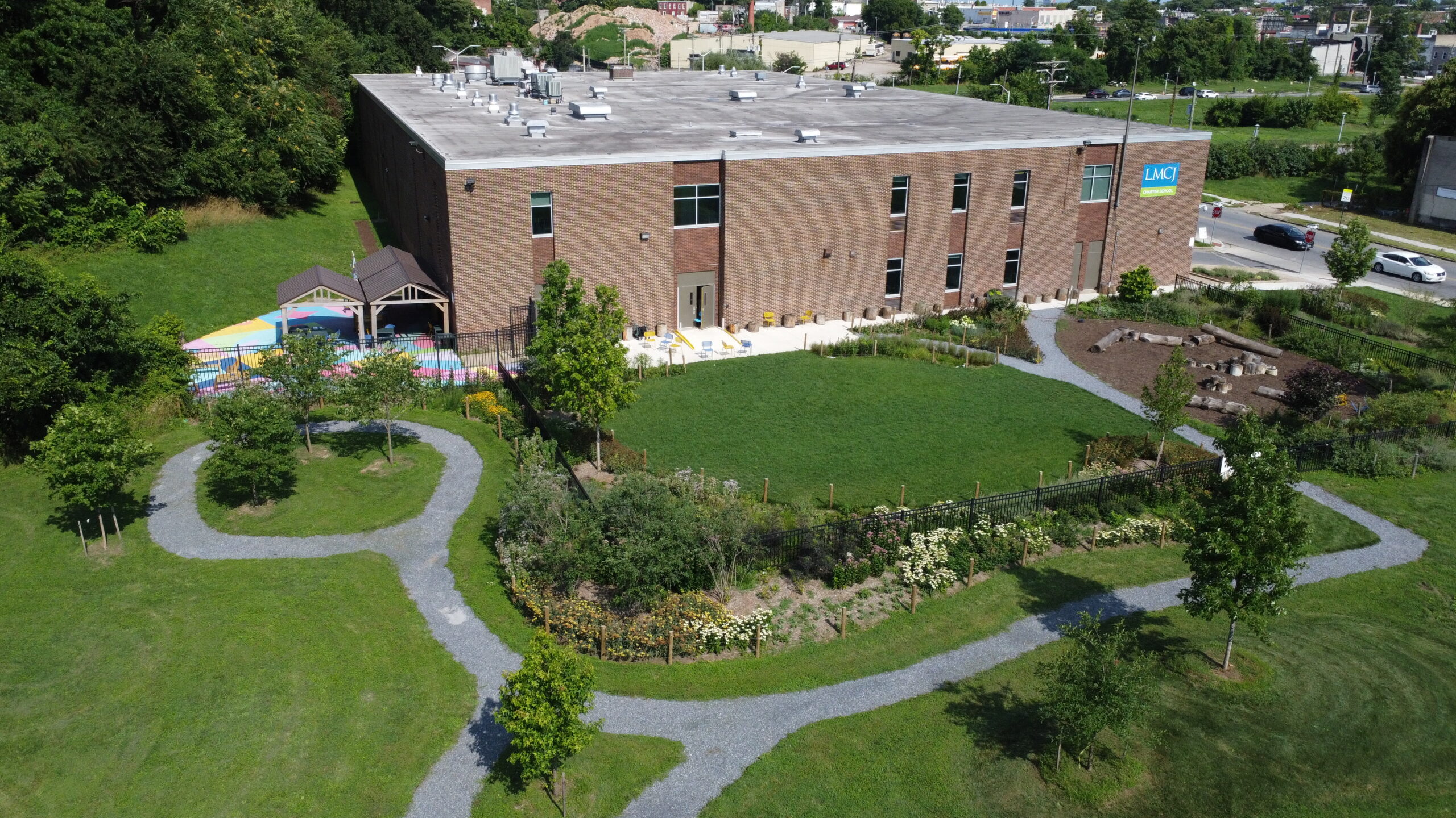 Aerial view of the LMCJ school building and landscaped grounds